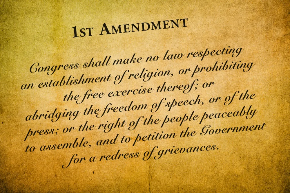 The text of the First Amendment printed on aged paper.